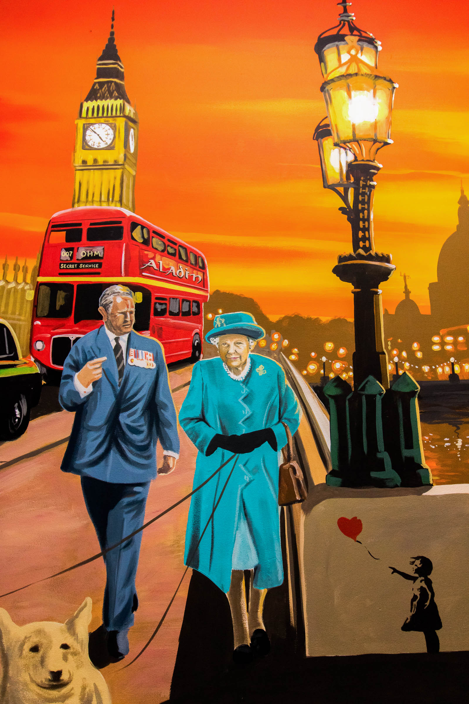 Aladin Mural Restaurant in Brick Lane - The Queen and Prince Charles under a Westminster Bridge streelight in a golden sunset