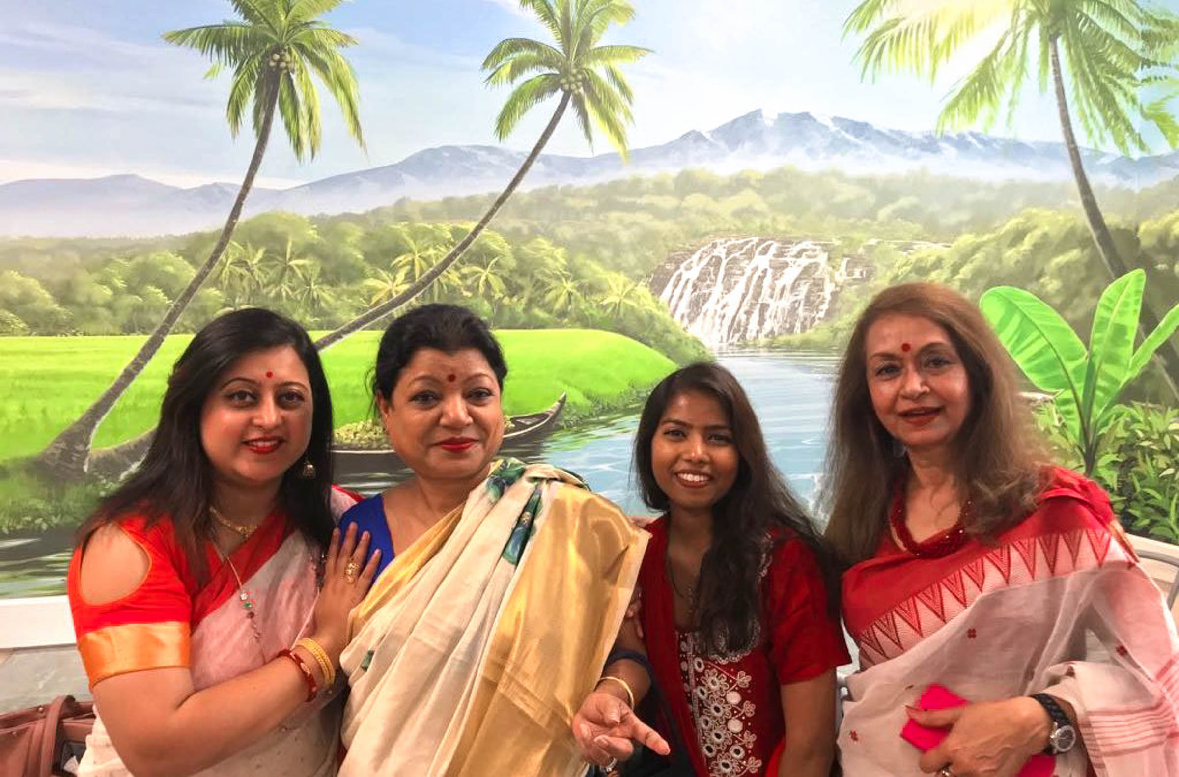 Indian ladies in front of The Bhavan Mural