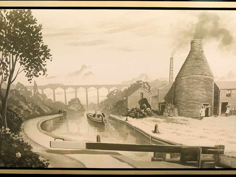 Potteries of Stoke-on-Trent theme painted on the side of a narrowboat