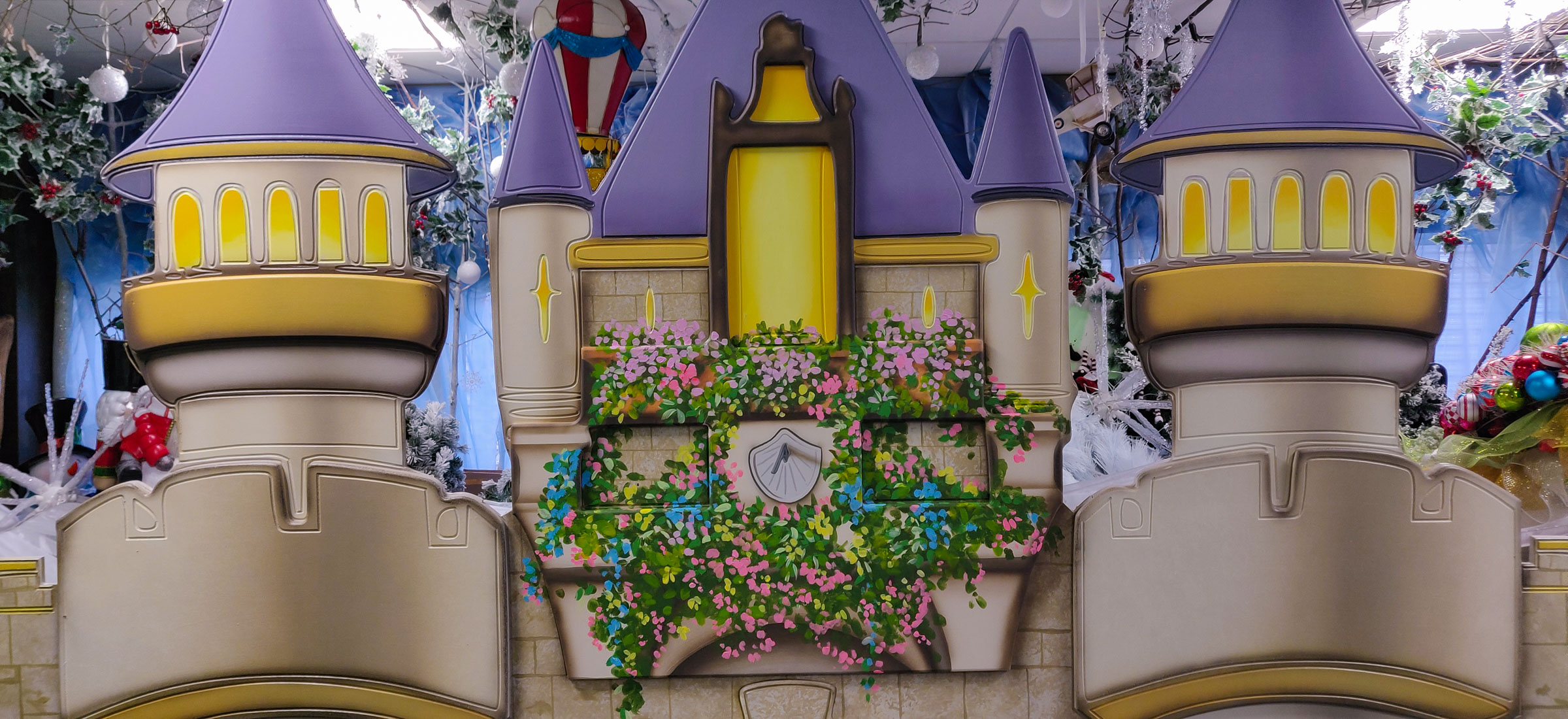 A little earlier on, showing the sundial clock and balcony. Interesting use of a robotic cutting machine to cut out the castle shapes from mdf and engrave some details.